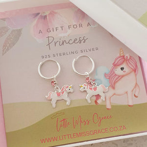 Silver hoop earrings with unicorns